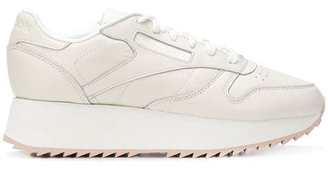 reebok white platform sneakers.